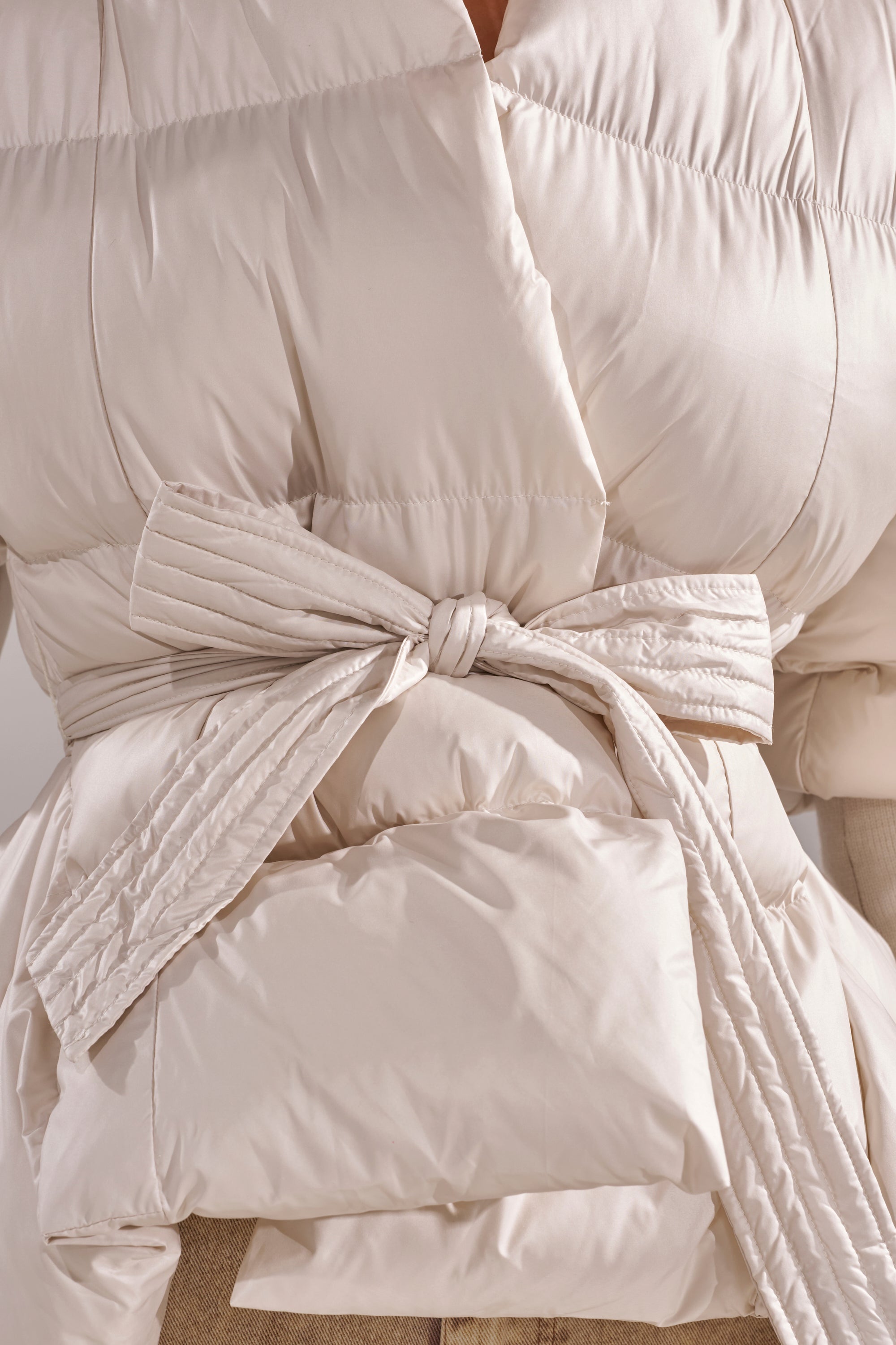 RIB SLEEVE PEPLUM PUFFER IN IVORY