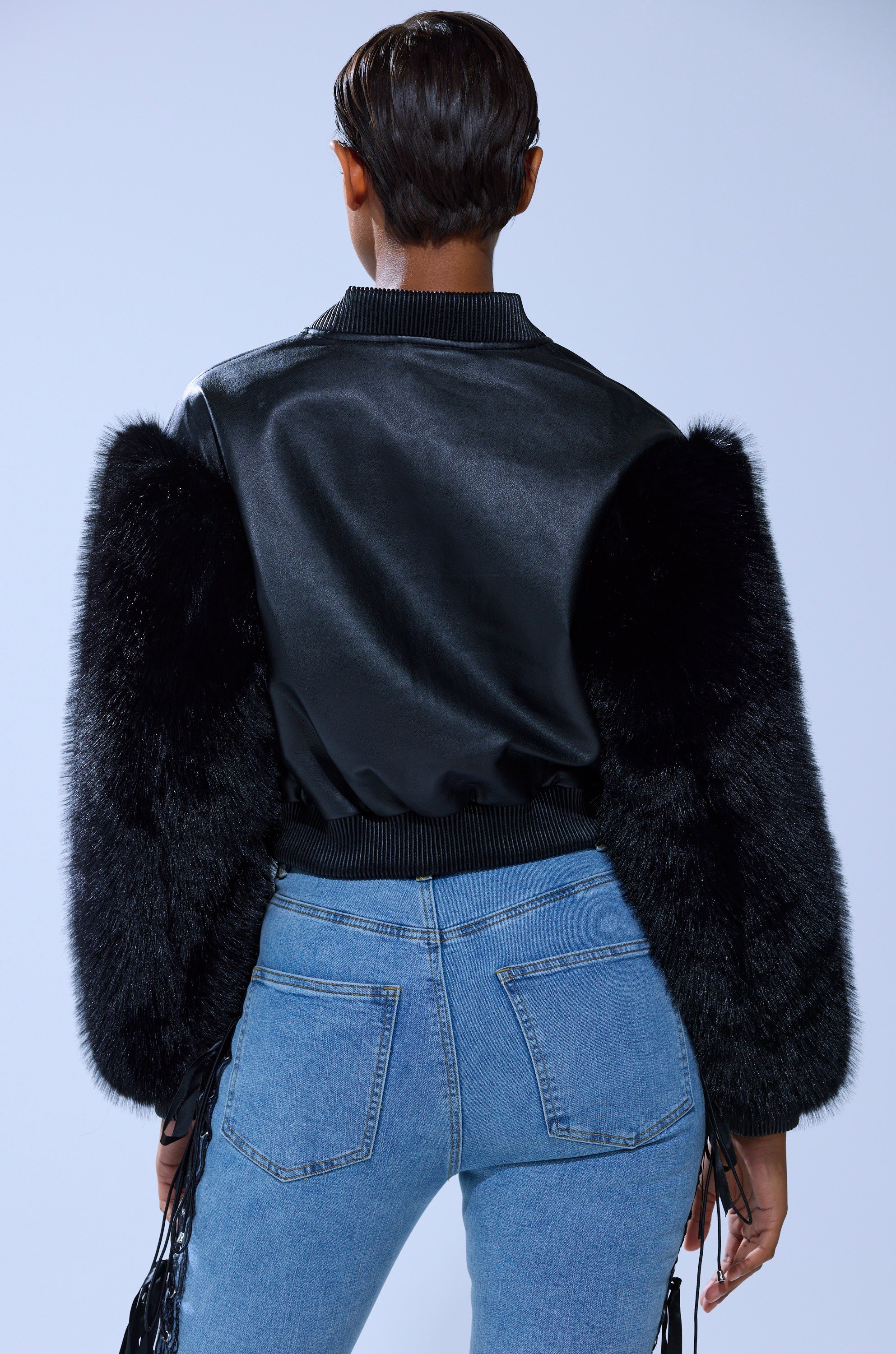 SO GOOD IT HURTS FUR SLEEVE BOMBER IN BLACK